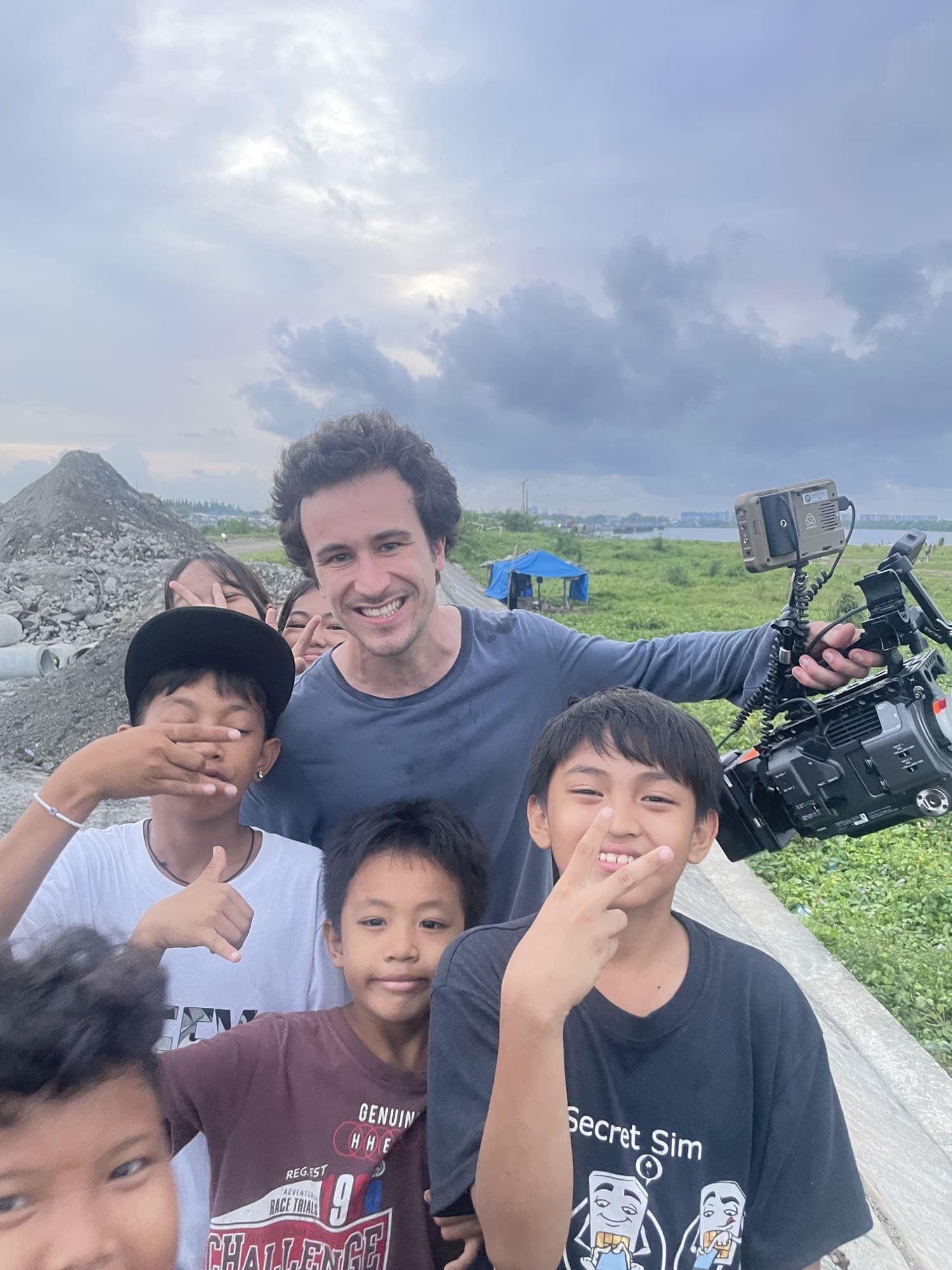 Antonio Mendes with local children on a documentary shoot